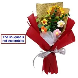 crochet sunflower and puff flowers in red bouquet