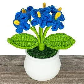 Blue crochet dont forget me flowers in a pot