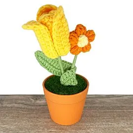 yellow tulip and orange daisy crochet flowers in vase