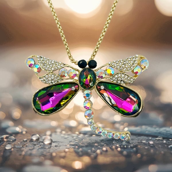 golden dragonfly pendant on warm sizzling background